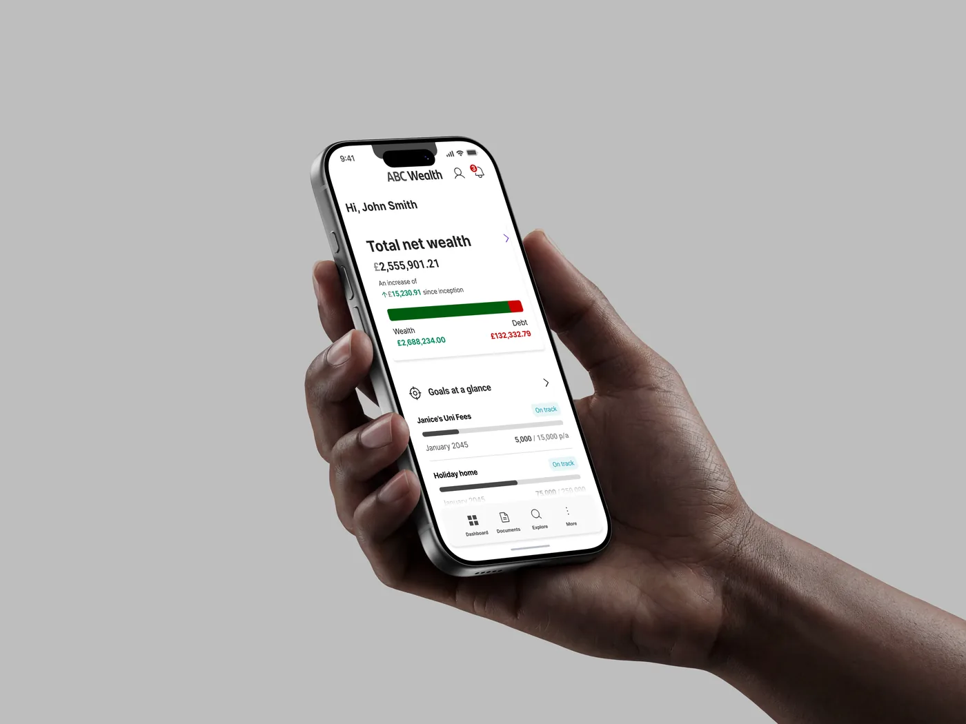 The client portal dashboard held in one hand, showing total net wealth and goals at a glance.
